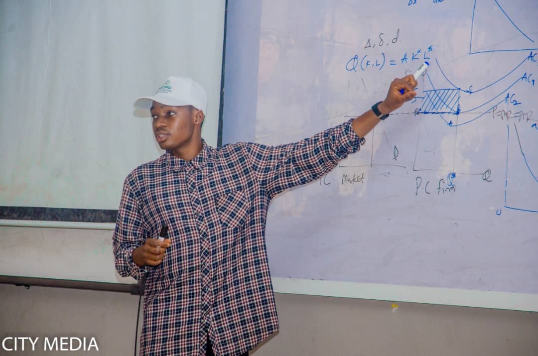 Muiz Olasupo teaching economics, classroom photograph 5
