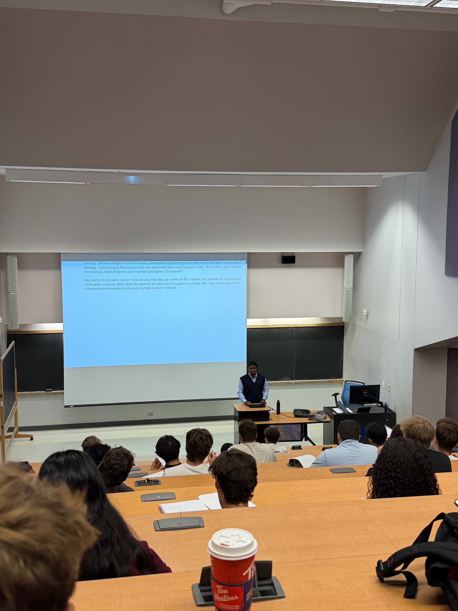 Muiz Olasupo teaching economics, classroom photograph 2